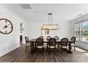 Elegant dining room with dark hardwood floors, modern light fixture and a dark wood dining table at 837 Kathy Dianne Dr, Indian Land, SC 29707