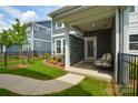 Cozy covered patio with string lights, a privacy screen, and comfortable seating for outdoor relaxation at 10209 Mamillion Dr, Huntersville, NC 28078