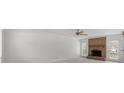 Empty living room with brick fireplace and natural light from window and glass door at 10600 Four Mile Creek Rd, Charlotte, NC 28277