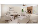 Bright living room with neutral furniture, brick fireplace, and natural light at 10600 Four Mile Creek Rd, Charlotte, NC 28277
