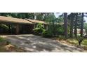 Exterior view of a brick home with a covered carport and a long driveway at 1116 Bryce Ave, Salisbury, NC 28144