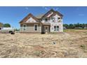Unfinished two-story home with visible construction materials at 11555 Valley Oak Ln, Stanfield, NC 28163