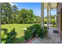 View of the large lawn and landscape from the beautiful columned covered front porch at 1252 Wendy Rd, Rock Hill, SC 29732
