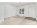Inviting living room with new carpeting, fresh neutral paint, and natural light at 1404 Waylon Ave, Gastonia, NC 28054