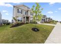 Lovely two-story home with a landscaped front yard and sidewalk leading to a welcoming neighborhood at 14116 Glaswick Dr, Charlotte, NC 28278