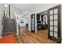 Spacious foyer featuring hardwood floors, a staircase, and doorway to a music room at 2090 Durand Rd, Fort Mill, SC 29715