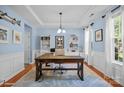 Stylish home office with custom built-ins, a large desk, and bright natural light at 3006 S Legacy Park Blvd, Indian Land, SC 29707