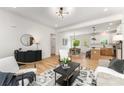 Bright and airy living room with hardwood floors that opens to the dining room and kitchen at 3486 Winters St, Newton, NC 28658