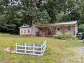 Charming home featuring a cozy covered porch, lovely garden, and well-maintained lawn at 370 Miracle Dr, Salisbury, NC 28146