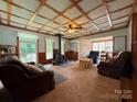 Spacious living room features wood ceilings, a cozy wood-burning stove, and comfortable seating at 370 Miracle Dr, Salisbury, NC 28146