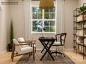 Bright home office with a large window, sleek black desk, and comfortable seating arrangements for productivity at 4246 Skyboat Cir, Fort Mill, SC 29715