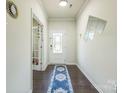 Inviting entryway boasts hardwood floors, elegant trim, and a stylish front door at 1012 Leland Dr, Wesley Chapel, NC 28104