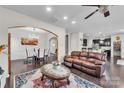 Open-concept living room showcases hardwood floors and seamless flow into the dining and kitchen areas at 1012 Leland Dr, Wesley Chapel, NC 28104