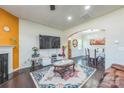 Cozy living room features a fireplace, large TV, and seamless flow into the dining area at 1012 Leland Dr, Wesley Chapel, NC 28104