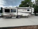 Cedar Creek Silverback Edition RV showcasing windows, entry door, and design at 104 Cardinal Dr, New London, NC 28127