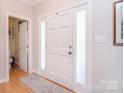 Inviting foyer with a light-filled entryway and sleek hardwood flooring at 14232 Kendalton Meadow Dr, Mint Hill, NC 28227