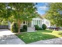 Lovely home boasting a neat front yard, a classic facade, and a convenient driveway, blending comfort and curb appeal at 232 Orange St, Charlotte, NC 28205