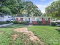 Inviting brick home with manicured lawn and charming front entrance at 6401 Montpelier Rd, Charlotte, NC 28210