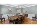 Formal dining area showcasing a wooden table and chandelier, perfect for gatherings at 1119 Williamstown Rd, Matthews, NC 28105