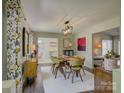 Modern dining room featuring stylish decor and a large table for entertaining at 116 Hallett St, Fort Mill, SC 29715
