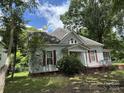 Exterior view of home showing red shutters and mature trees at 118 Hemphill Ave, Chester, SC 29706
