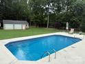 Refreshing backyard pool with a spacious deck, perfect for relaxation and entertaining at 1489 L R Schronce Ln, Iron Station, NC 28080