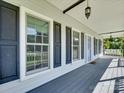 A relaxing front porch featuring stylish windows and shutters at 1529 Covenant Pl, Rock Hill, SC 29732