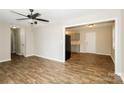 Open-concept living room and kitchen with modern wood floors and neutral paint colors at 201 Killian Cir, Clover, SC 29710