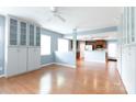 Inviting living room featuring hardwood floors, neutral paint, and seamless access to the kitchen at 405 Jenny Skip Ln, Rock Hill, SC 29732