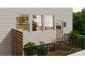 Outdoor deck with seating, potted plants, and a view from the side of the property at 4059 Bass River Pkwy, Charlotte, NC 28217