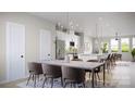Dining area with modern table and chairs near a kitchen with white cabinets at 4059 Bass River Pkwy, Charlotte, NC 28217