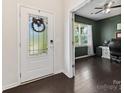 Bright foyer leading to an office featuring hardwood floors and a modern ceiling fan at 4261 Coachwhip Ave, Lancaster, SC 29720