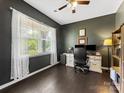 Comfortable home office with large window, dark walls, and hardwood floors at 4261 Coachwhip Ave, Lancaster, SC 29720