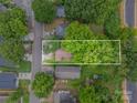 Aerial view of a home and its surrounding property with mature trees at 4510 Wildwood Ave, Charlotte, NC 28208