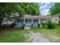 Charming single-story home showcasing a welcoming front porch and a well-maintained lawn at 4510 Wildwood Ave, Charlotte, NC 28208