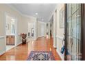 Elegant foyer with hardwood floors and natural light, creating a grand entrance to the home at 4527 Hubbard Falls Dr, Charlotte, NC 28269