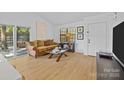 Cozy living room with hardwood floors, sliding glass doors, and ample natural light at 498 Glory Ct, Fort Mill, SC 29715