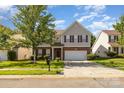 Charming two-story home with brick accents, a well-manicured lawn, and a two-car garage at 5307 Ayers Orchard Way, Charlotte, NC 28227