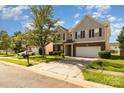 Charming two-story home with brick accents, a well-manicured lawn, and a two-car garage at 5307 Ayers Orchard Way, Charlotte, NC 28227