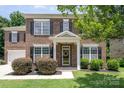 Lovely brick home with classic architectural details, including a welcoming front entrance at 704 Millstream Dr, Rock Hill, SC 29732