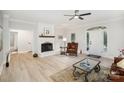 Bright living room featuring a cozy fireplace and modern flooring, perfect for relaxation and entertaining at 7408 Mockingbird Ln, Waxhaw, NC 28173