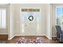 Bright foyer featuring a white front door with glass panels and sidelights at 8427 Penton Pl, Harrisburg, NC 28075
