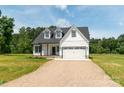 Charming two-story home featuring a two-car garage and long driveway at 1010 Oneil Dr, Monroe, NC 28112