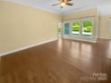Spacious living room featuring hardwood floors and abundant natural light at 13419 Morgan Lee Ave, Charlotte, NC 28213