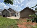 Back of house showing patio and exterior siding at 156 Tarrington Dr, Statesville, NC 28625