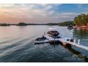Jet skis parked on dock with sunset background at 175 Rehoboth Ln, Mooresville, NC 28117