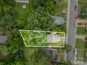 Aerial view showcases the property's boundaries surrounded by lush greenery at 2312 Tate St, Charlotte, NC 28216