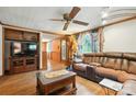 This spacious living room features wood floors, a large sectional sofa, and a vintage grandfather clock at 4412 Dobys Bridge Rd, Fort Mill, SC 29707