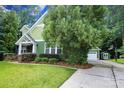 Large driveway with basketball hoop, shed, and additional garage space at 458 Leaf Arbor Ct, Clover, SC 29710