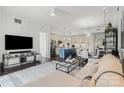 Inviting living room with open layout, seamlessly connected to the dining area and modern kitchen at 4625 Piedmont Row Dr # 712, Charlotte, NC 28210